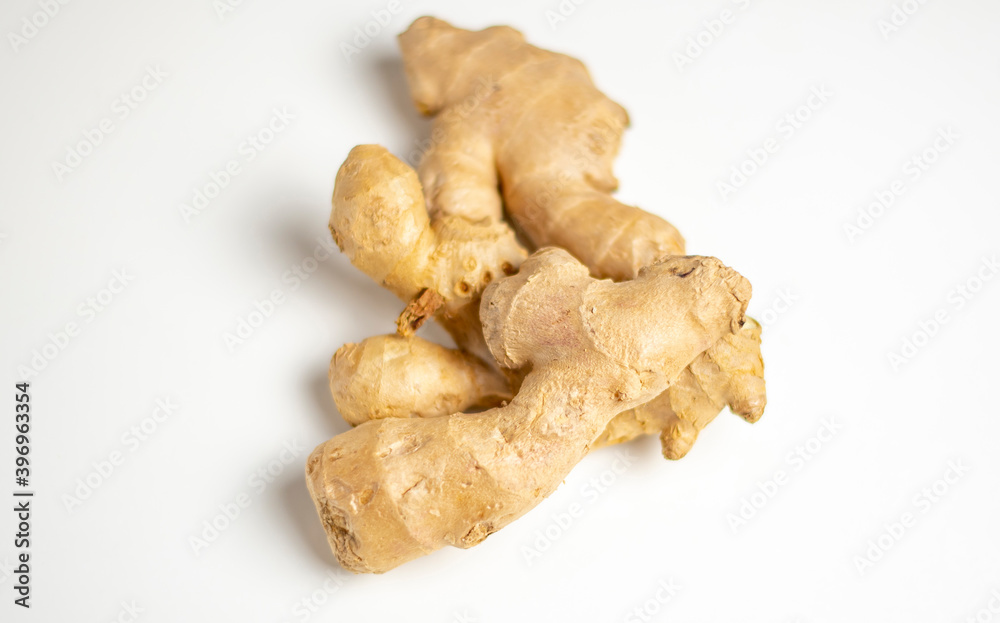 ginger on a white background close-up, horizontal position ginger on a white background close-up, horizontal position