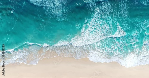 Aerial view of sandy beach and ocean with waves photo