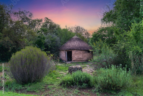 Konstfotografi Round traditional African village hut made of clay mud and straws in Bloemfontei
