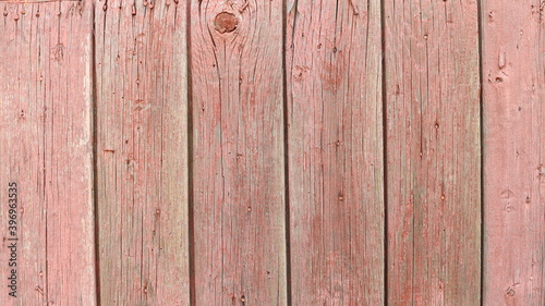 rustic old wood surface made of textured rough planks of pinkish brown color with bunch dots and dry cracks in structure, country style backdrop
