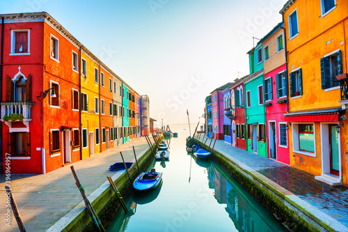Fototapeta Naklejka Na Ścianę i Meble -  Colorful houses on the canal in Burano island, Venice, Italy. Famous travel destination.