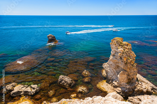 Beautiful sea coast with turquoise water and rocks. Tarhankut Cape on the western coast of Crimea peninsula. Summer seascape, famous travel destination photo