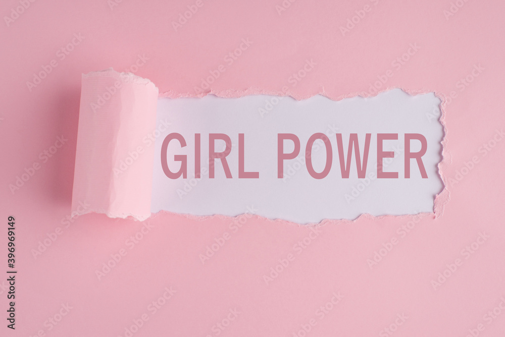 Fototapeta Girl power concept inscription written on torn paper pastel pink and white color backdrop