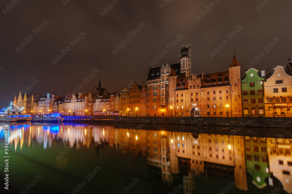 Wonderful night view of Gdansk with reflection of houses in the water	