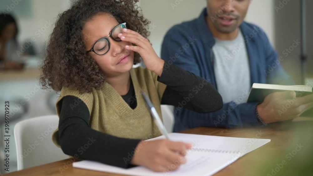 Daddy helping daughter with homework Daddy helping daughter with homework
