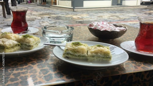Turkish Baklava and tea, Baklava video, milky pistachio baklava, eating Turkish baklava in the street