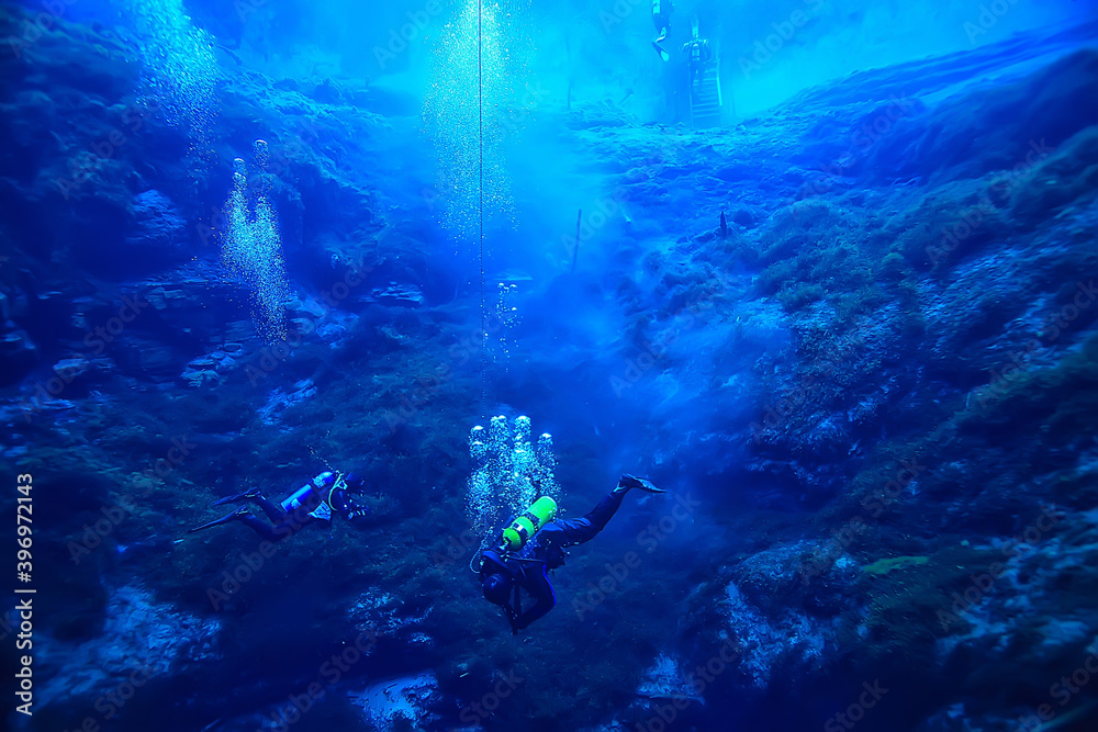 Obraz premium diver breathes air under water bubbles, releases gas, landscape underwater depth