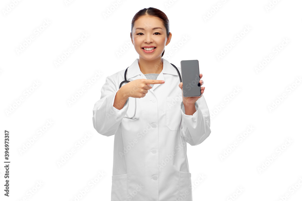 medicine, technology and healthcare concept - happy smiling asian female doctor or nurse with stethoscope with smartphone over white background medicine, technology and healthcare concept - happy smiling asian female doctor or nurse with stethoscope with smartphone over white background