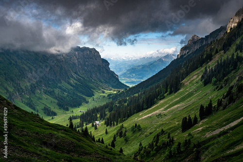 Blick durchs bewölkte Justistal auf den Thunersee photo