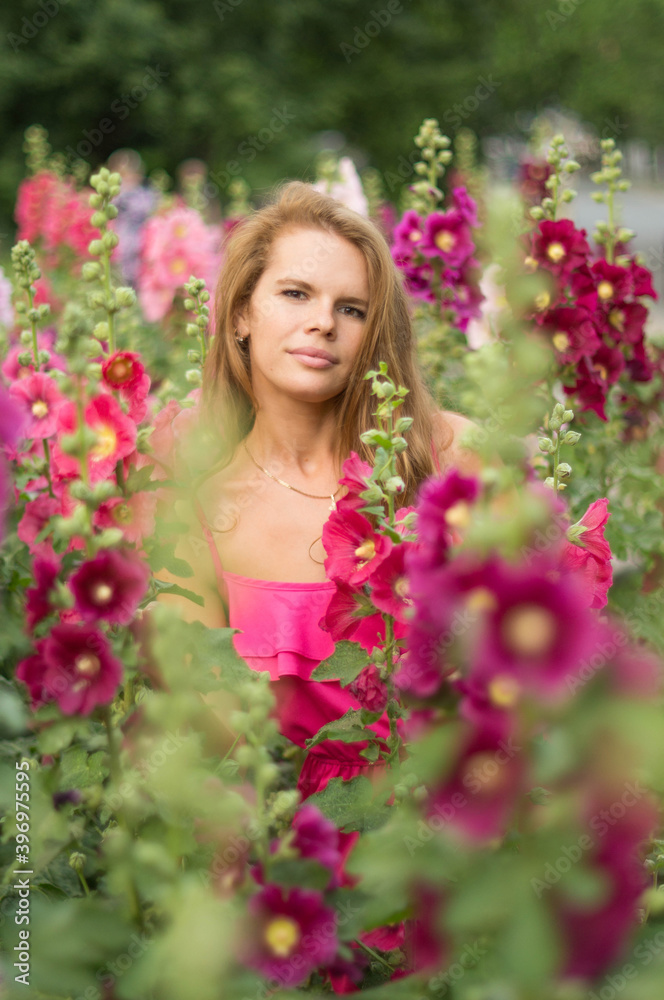 woman with flowers in the garden woman with flowers in the garden