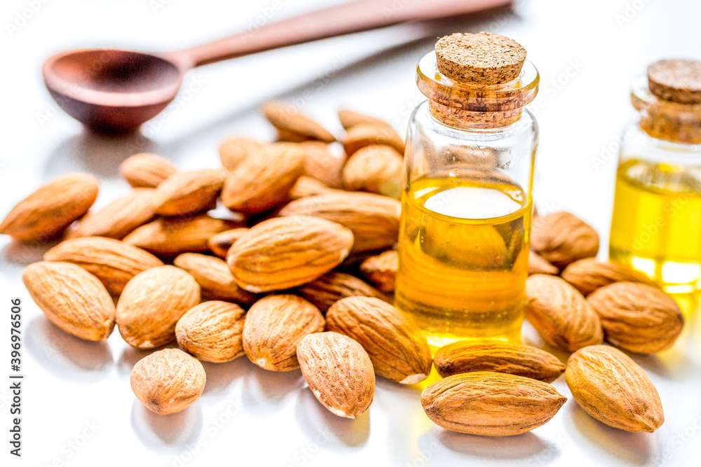 spa with almond oil in organic cosmetic set on white background spa with almond oil in organic cosmetic set on white background