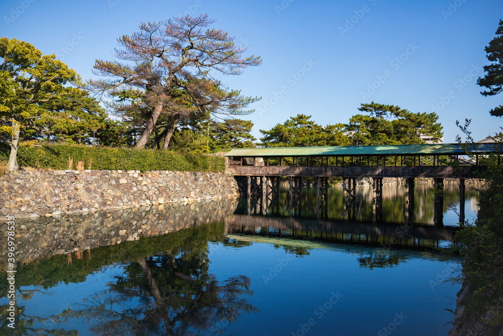 View with a covered bridge over the moat , Takamatsu city, kagawa, shikoku, japan
