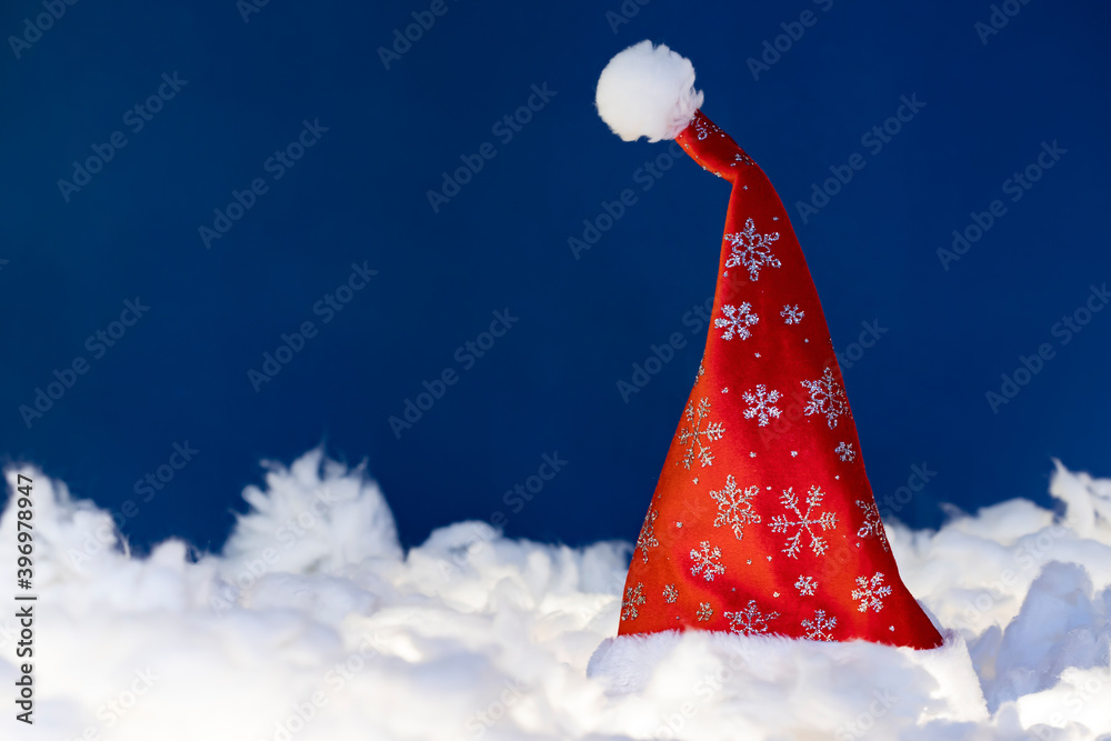 Red santa hat in the snow. Red santa hat in the snow.