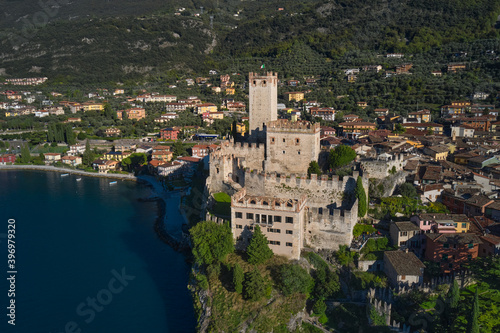 Panoramic aerial view of Scaliger Castle in Malcesine, Malcesine town. Italian resort on Lake Garda, Monte Baldo. Malcesine town, Lake Garda, Italy.