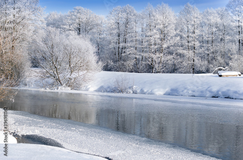 frozen snowy river banks scenery