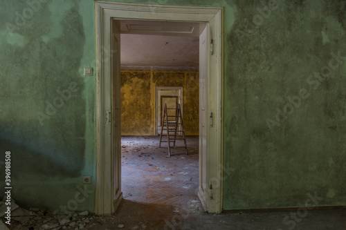 many doors with colorful walls in a abandoned house