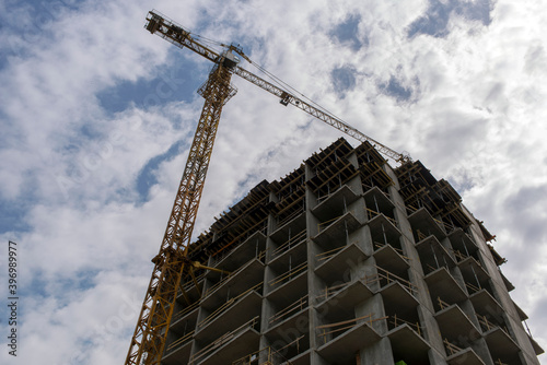 Tower crane. Construction site. Production of apartments, social housing.