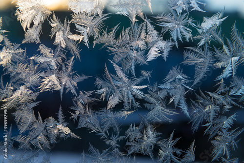 Beautiful natural frosty pattern on winter window.
