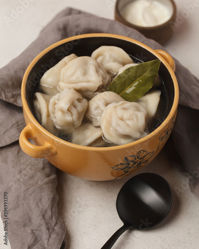 Prepared semi-finished products. Dumplings, khinkali, manti. New year's atmosphere