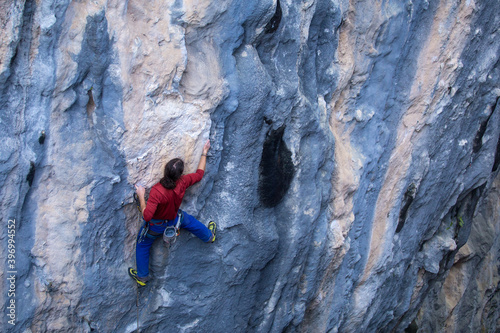 A strong man climbs a rock, Rock climbing in Turkey. © zhukovvvlad