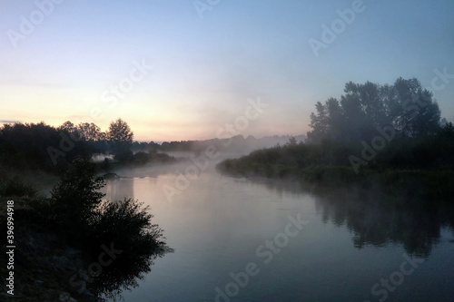 Beautiful misty morning over a winding river.