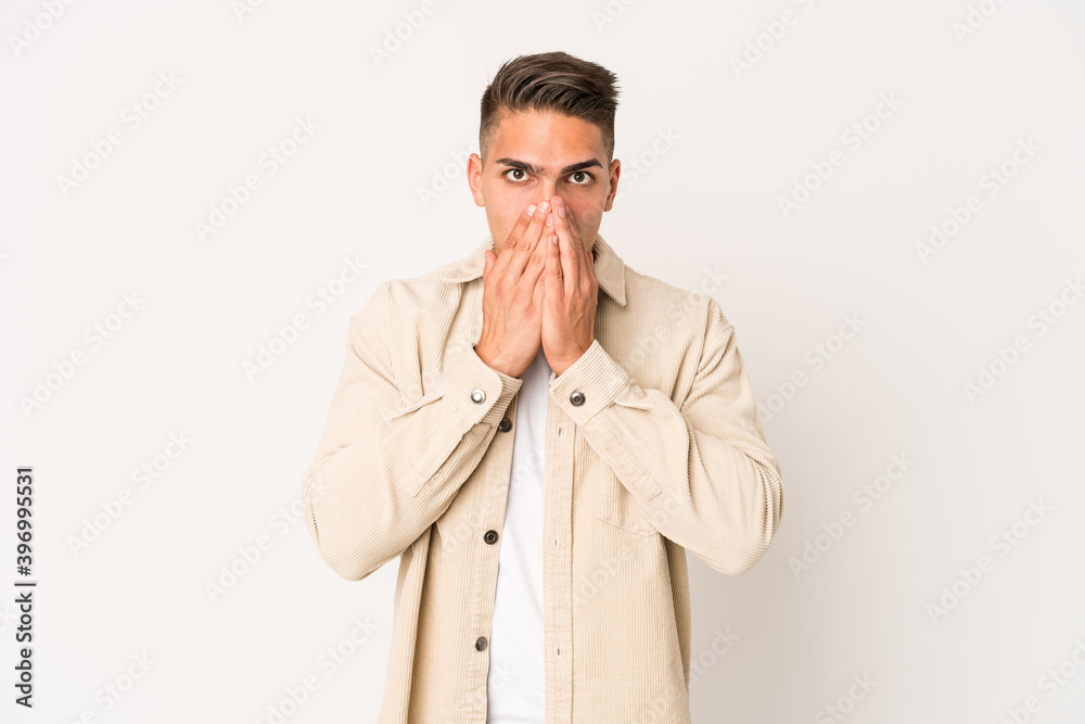 Young caucasian handsome man isolated shocked covering mouth with hands. Young caucasian handsome man isolated shocked covering mouth with hands.