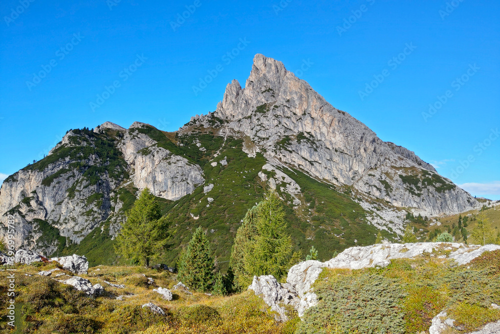 View of the beautiful Dolomites mountains in Italy against the background of blue sky.