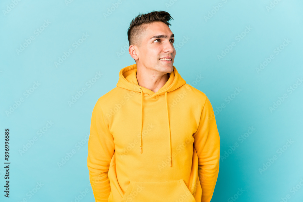 Young caucasian handsome man isolated relaxed and happy laughing, neck stretched showing teeth. Young caucasian handsome man isolated relaxed and happy laughing, neck stretched showing teeth.