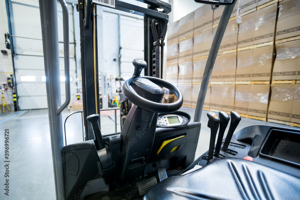 Forklift steering wheel in warehouse