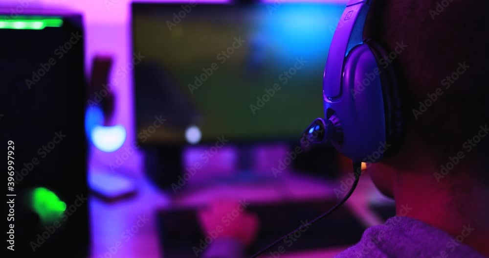 Young streamer gamer playing at strategy game in broadcast browser - Male guy having fun gaming and streaming online - New technology game trends and entertainment concept