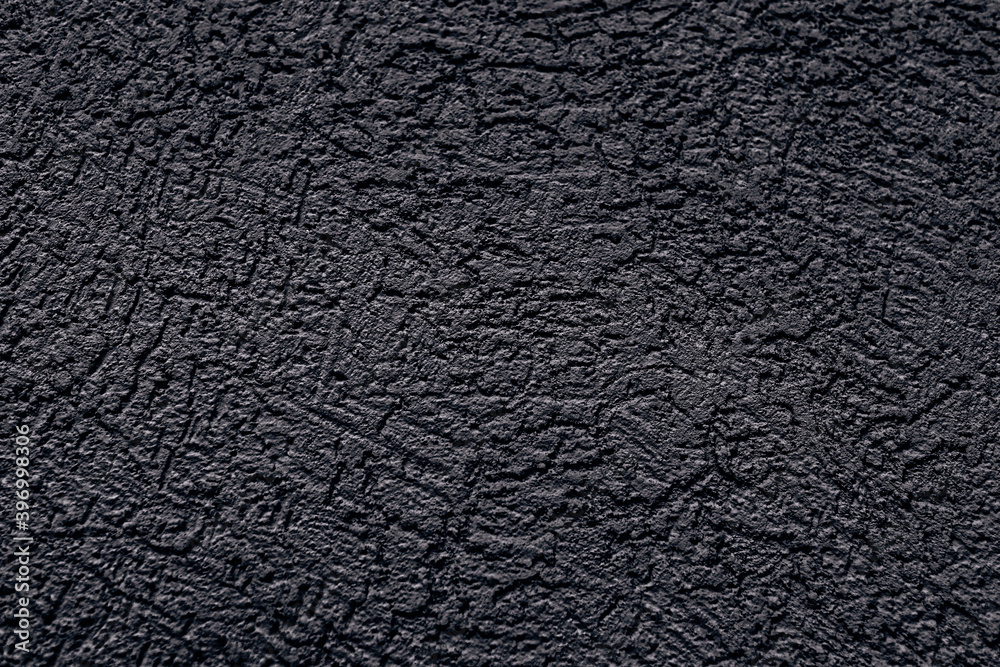 The wall is made of plaster with scratches. Rough surface. abstract gray background. A template for the design of a website or ad.
