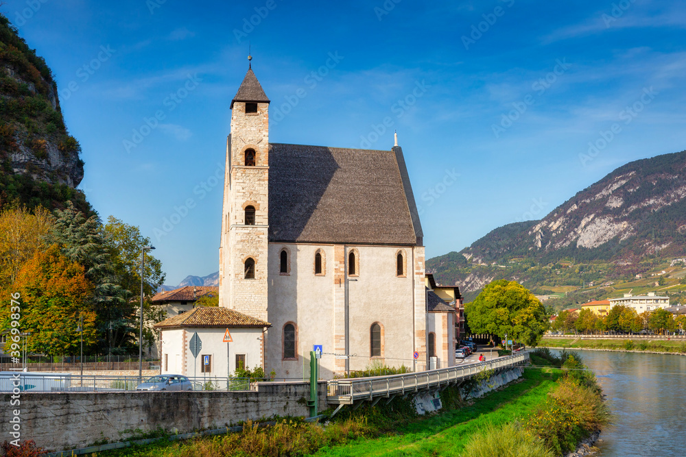 Beautiful scenery of Trento city with Saint Apollinare church at Adige river, Northern Italy