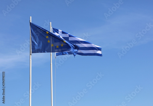 European Union and Greek Flags flying in the air in Kos, Greece