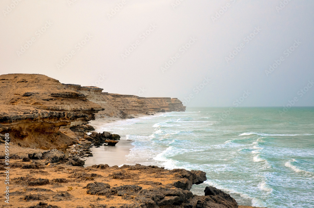 Waves crashing on rocks in the Oman