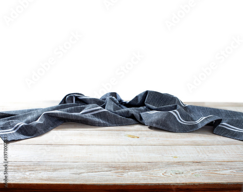 Table cloth on wooden desk isolated on white.