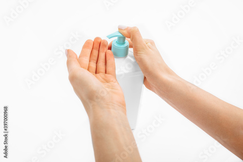 Disinfection of hands. hands applying antiseptic spray to prevent coronavirus or flu, on a white background,