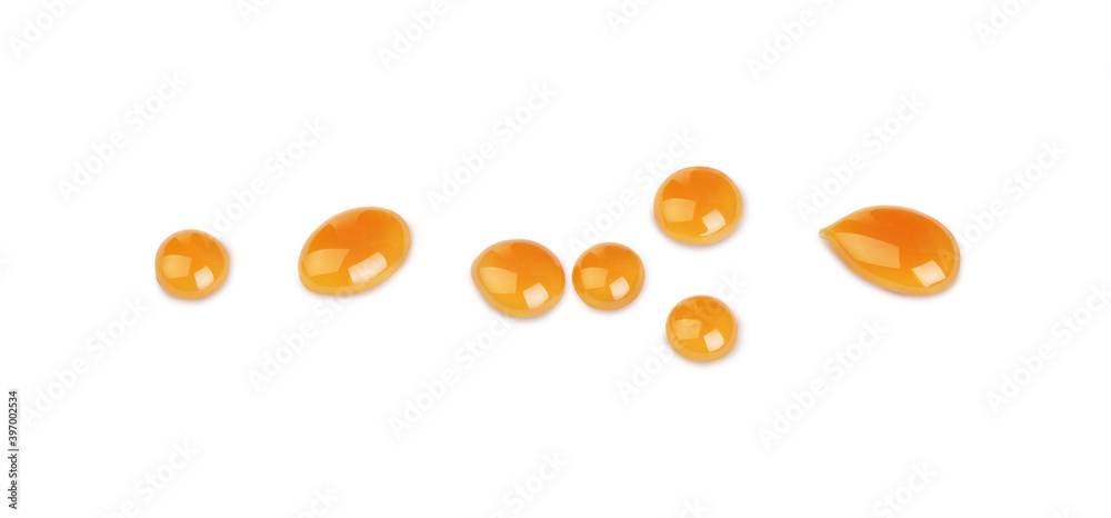 Caramel drops on white background Caramel drops on white background