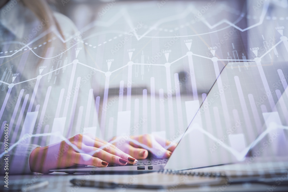 Double exposure of woman hands working on computer and forex graph hologram drawing. Financial analysis concept. Double exposure of woman hands working on computer and forex graph hologram drawing. Financial analysis concept.