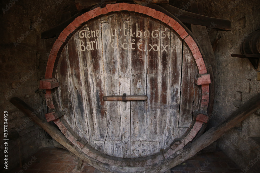 the monumental Barrel of the Canons in the city of Gubbio. The capacity, equivalent to 20124 liters, is written on the front of the barrel in the ancient local language