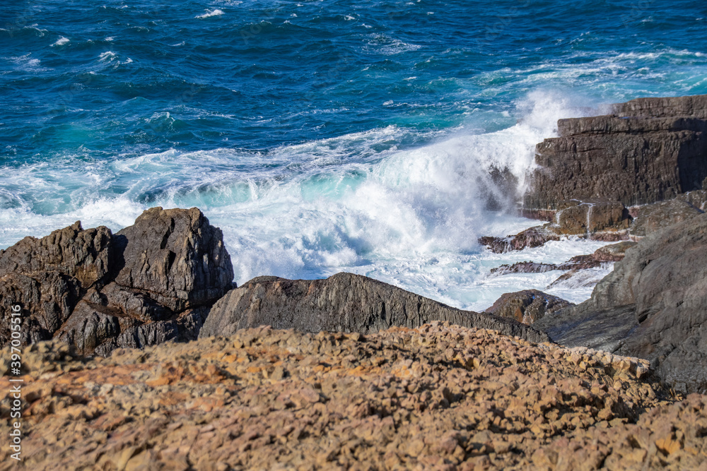日本海の荒波と柱状節理の岩礁　島根県出雲市大社町　The raging waves of the Sea of Japan and column pillar   rocks