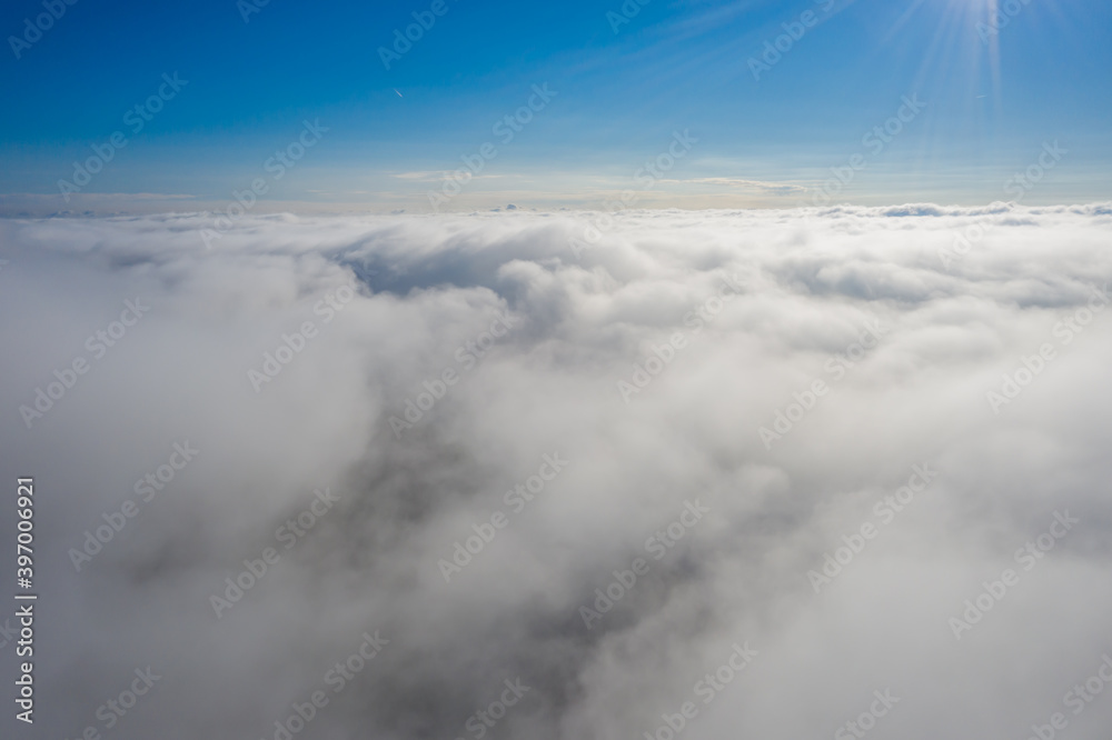 aerial photo of clouds photographed using a quadcopter while above the clouds