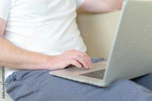 A man works at home at a computer