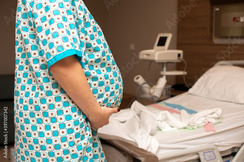 Pregnant woman in newborn hospital lying near fetal heart beat by fetal monitoring with Non stress test(NST). Mother giving birth to a baby. Belly of pregnant women. Diagnostic, healthcare, check up