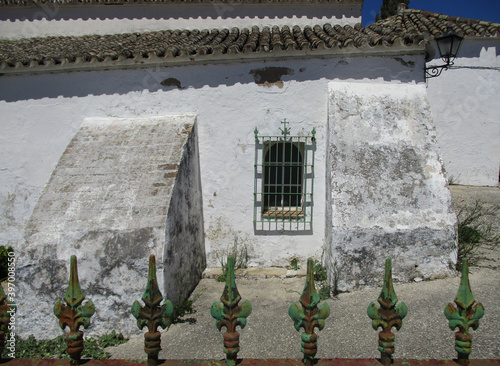 View facade with buttress of the Santos Martires Visigothic Hermitage in the town of Medina Sidonia. Andalusia. 