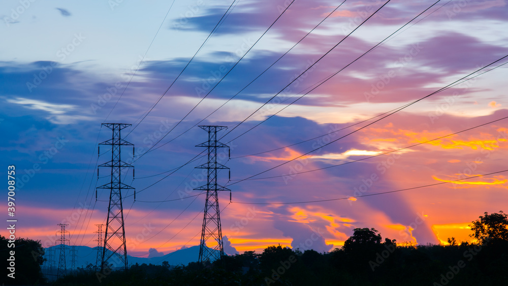 Dramatic sunset at electricity pylons
