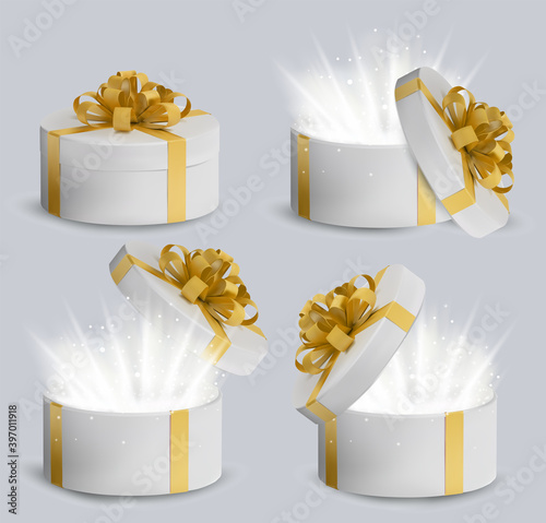 Collection Gift white box in a gold ribbon and bow on top. Holiday, gift round box with sparkles inside and bright rays of light. New Year and Christmas design. Vector illustration.