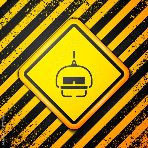 Black Ski lift icon isolated on yellow background. Warning sign. Vector.