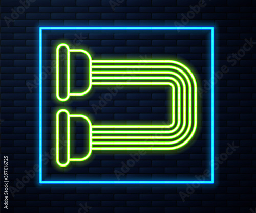 Glowing neon line Chest expander icon isolated on brick wall background. Vector.