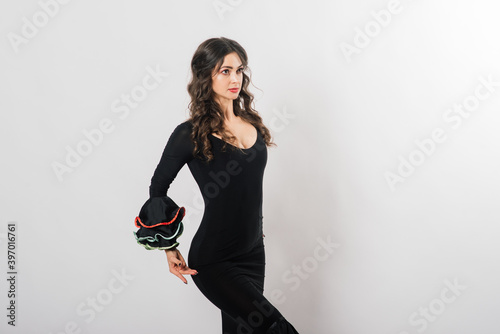 Portrait of beautiful young woman dancing flamenco in studio