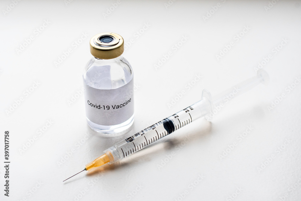 a vial with a medicine for the coronavirus, a vaccine for covid-19 with a syringe and needle a vial with a medicine for the coronavirus, a vaccine for covid-19 with a syringe and needle